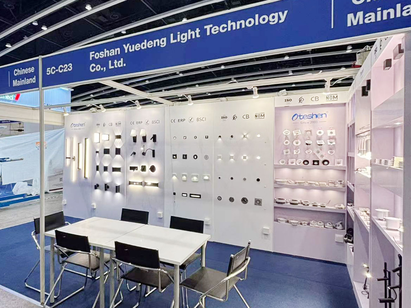 OTESHEN booth 5C-C23 Hong Kong Autumn Lighting Fair, full booth view with LED downlight, spotlights, wall lamps and negotiation table, Foshan LED lighting manufacturer